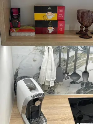 a shelf with a toaster and other items on it at Studio with a view on City center park in Maribor