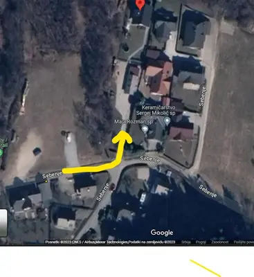 a map with a yellow arrow pointing to a building at Koča Kopriva in Križe