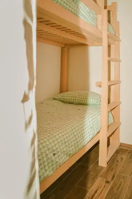 a bunk bed in a bedroom with a bunk bed in a room at Holiday Home GaMaJaMa in Dobravlje