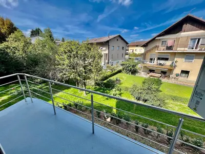 a balcony with a view of a yard at Jacobs Legacy - 4 Bedroom House, Free Parking, near City Center in Ljubljana