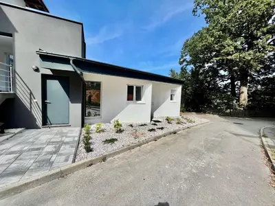a white house with a driveway in front of it at Jacobs Legacy - 4 Bedroom House, Free Parking, near City Center in Ljubljana