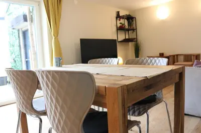 a dining room table with chairs around it at Ljubljana's secret place in Ljubljana