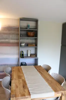 a dining room with a wooden table and chairs at Ljubljana's secret place in Ljubljana