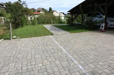 a brick driveway with a yard in a house at Ljubljana's secret place in Ljubljana