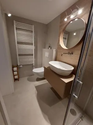 a bathroom with a sink and a mirror and a toilet at Ljubljana's secret place in Ljubljana
