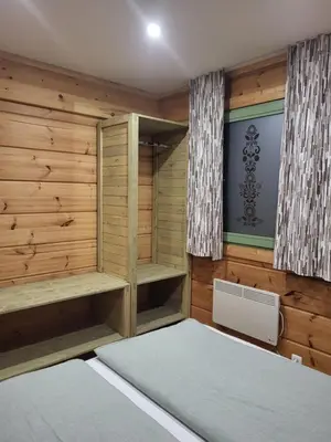 a sauna with wooden walls and wooden shelves at Apartment Jeršin in Rateče