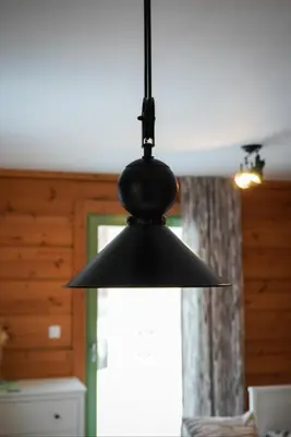 a black light hanging from a ceiling at Apartment Jeršin in Rateče