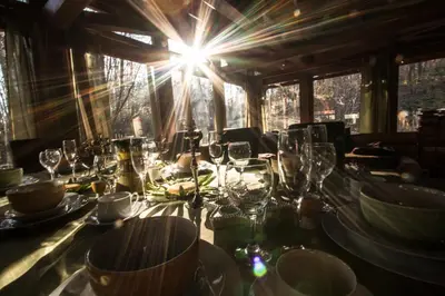 a table with wine glasses on it in a room at Koča na samem in Moravske Toplice