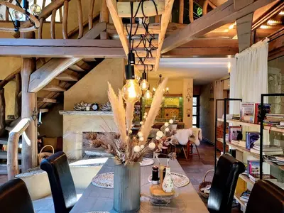 a dining room with a table and chairs at Koča na samem in Moravske Toplice