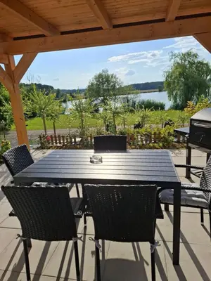 a table and chairs on a patio with a grill at Prenočišče ČERNOŠA Apartma Studio in Gradišče v Slovenskih Goricah