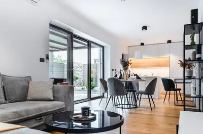 a living room with a couch and a table at Apartma Vila Center LUX in Slovenj Gradec