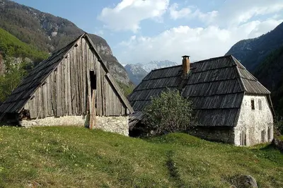 an old barn sitting on top of a hill at Apartment Mars in Bovec
