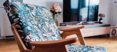 a chair with a pillow on it in a room at Panoramic LOFT in the CityCenter in Maribor