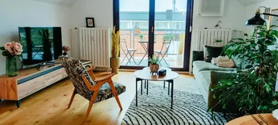 a living room with a couch and a table at Panoramic LOFT in the CityCenter in Maribor