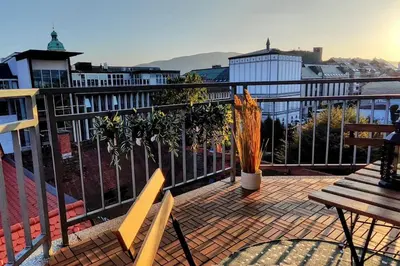 a balcony with two benches and a fence at Panoramic LOFT in the CityCenter in Maribor
