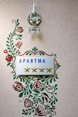 a sign that says aprilana on a wall at Csárdás Salaš in Dobrovnik