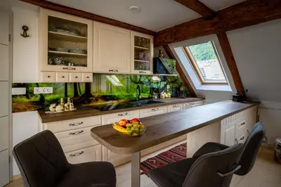 a kitchen with a bowl of fruit on a counter at Panorama in Bohinj