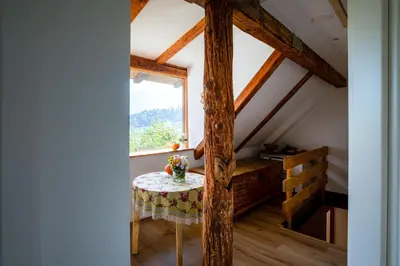 a small table in a room with a window at Panorama in Bohinj