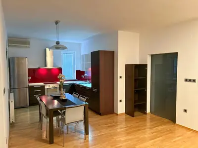 a kitchen and dining room with a table and chairs at House Stars in Ljubljana