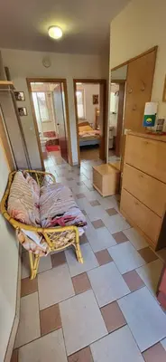 a room with a bed on a tiled floor at Apartma Ob Krki in Straža