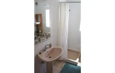 a white bathroom with a sink and a shower at 3 Bedroom Amazing Home In Tolmin in Tolmin