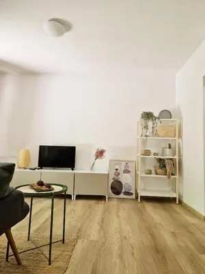 a living room with a couch and a table at Apartments Bassanese in Bled