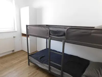 a couple of bunk beds in a room at Elegant Apartment Poklukarjeva Street in Ljubljana
