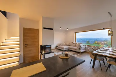 a living room with a couch and a table at Styria Estate, near Terme Olimia Spa Resort in Podplat