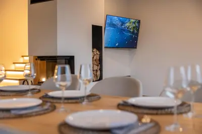 a table with plates and wine glasses on it at Styria Estate, near Terme Olimia Spa Resort in Podplat
