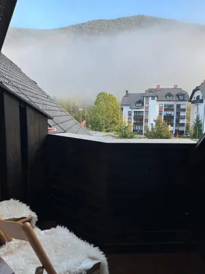 a view of a balcony with a view of a city at Little King - Feel like at home in Kranjska Gora