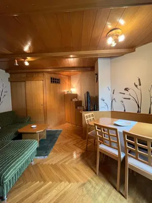 a dining room with a table and chairs at Little King - Feel like at home in Kranjska Gora