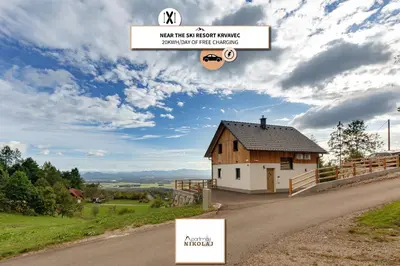 a house on the side of a road at Apartments Nikolaj in Preddvor