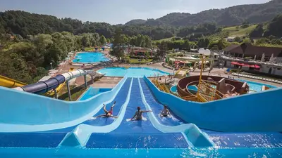 a large water park with a water slide at F96 TERME OLIMIA, Aqualuna KAMP NATURA PODČETRTEK card included all year in Podčetrtek