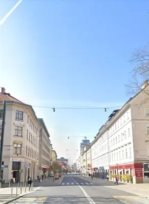 an empty street in a city with buildings at Family apartment in the city centre - FREE parking garage in Ljubljana