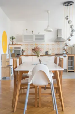 a kitchen and dining room with a table and chairs at Family apartment in the city centre - FREE parking garage in Ljubljana