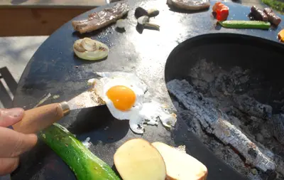 an egg on a grill with an egg on it at Country House Trata in Kranjska Gora