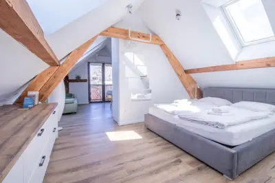 a bedroom with a bed in a attic at BLED LAKE HOUSE - Apartment SKY in Bled