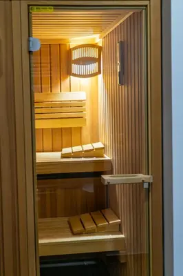 a walk in closet with a glass door at Apartmajska hiša Breza in Ribnica na Pohorju