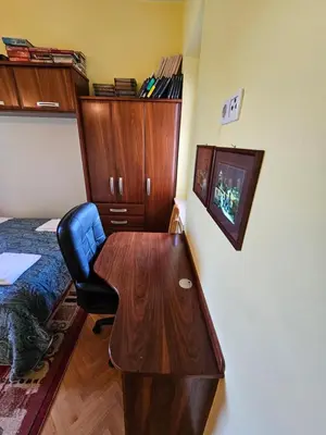 a bedroom with a desk and a bed and a desk and a chair at apartment AURORA in Rogaška Slatina