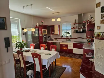 a kitchen with a table and chairs in a kitchen at apartment AURORA in Rogaška Slatina