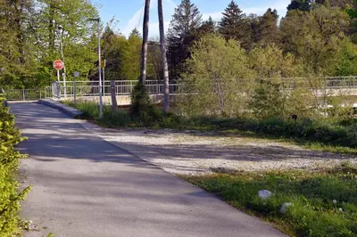 a road with a stop sign next to a fence at Vila Jasna in Radovljica