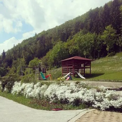 a park with a gazebo and a playground at Guest house Pr Ambružarju & Apartments in Cerklje na Gorenjskem
