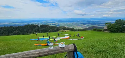 a group of people on a grassy hill at Guest house Pr Ambružarju & Apartments in Cerklje na Gorenjskem
