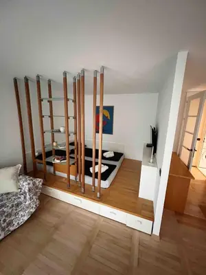 a room with a room with a bed and a tv at Comfy flat in city-FREE parking in Ljubljana