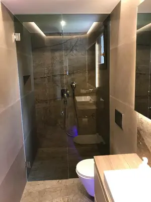 a bathroom with a shower with a toilet and a sink at Holiday Home Anja in Bohinj