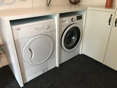 a washing machine and a dryer in a kitchen at Holiday Home Anja in Bohinj