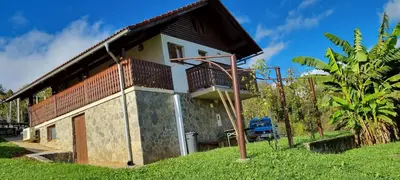 a small house with a balcony on the side of it at Marinčeva zidanica in Črnomelj