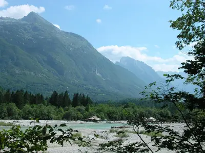 a view of a river with mountains in the background at Apartment Kenda in Bovec