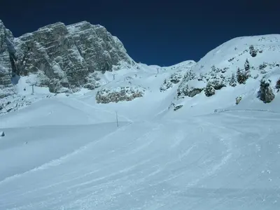 a snow covered mountain with a snow covered slope at Apartment Kenda in Bovec