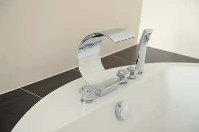 a bathroom sink with a mirror on top of it at City Hotel Krško in Krško